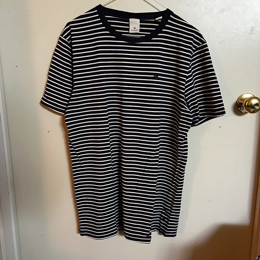 Medium navy blue and white striped Scotch and Soda tee shirt.